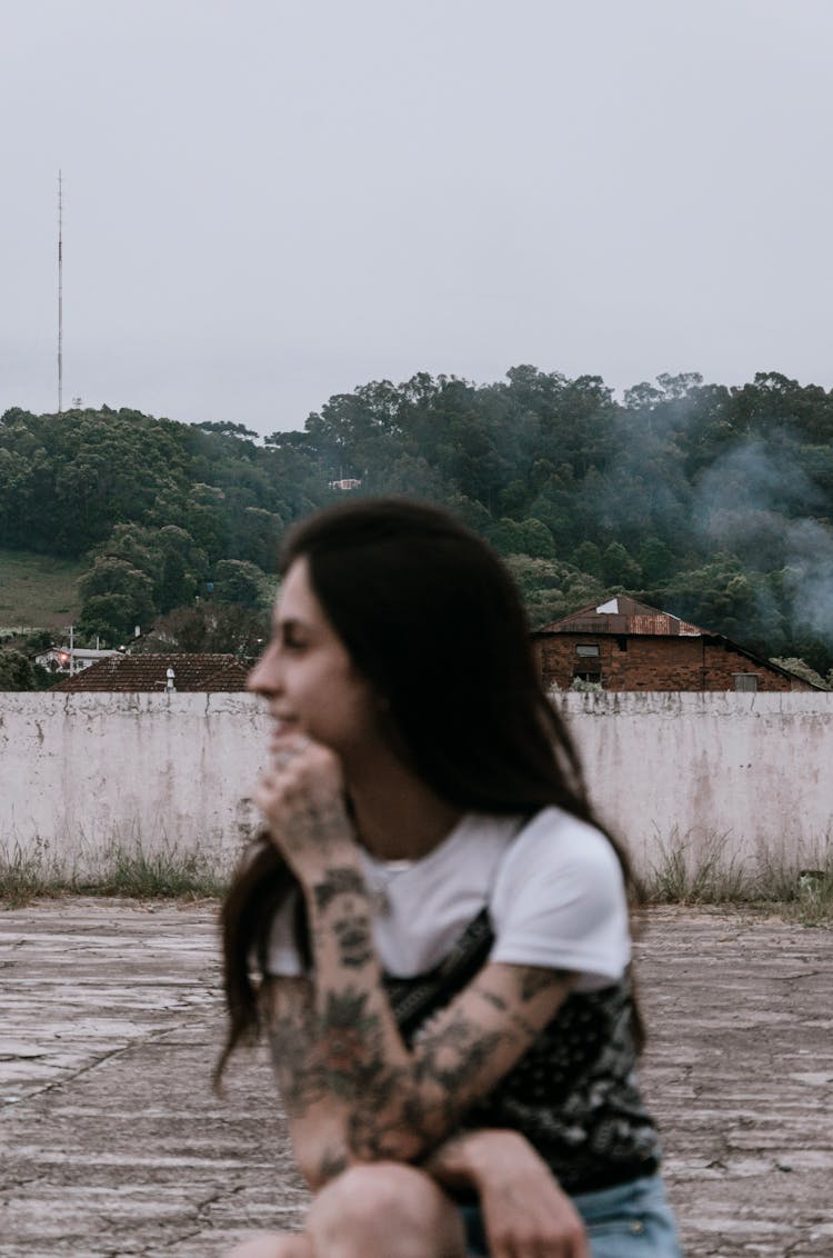 Young Woman With Tattoos Outdoors 