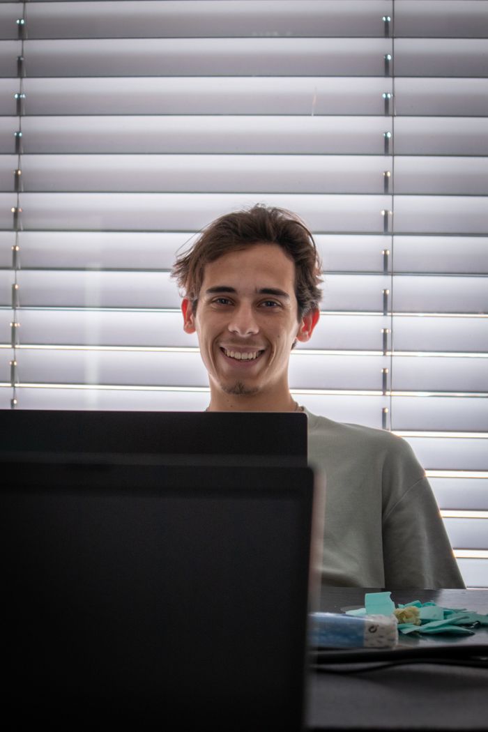 Devin Roscoe at his desk — photo by Joao Valverde on Pexels