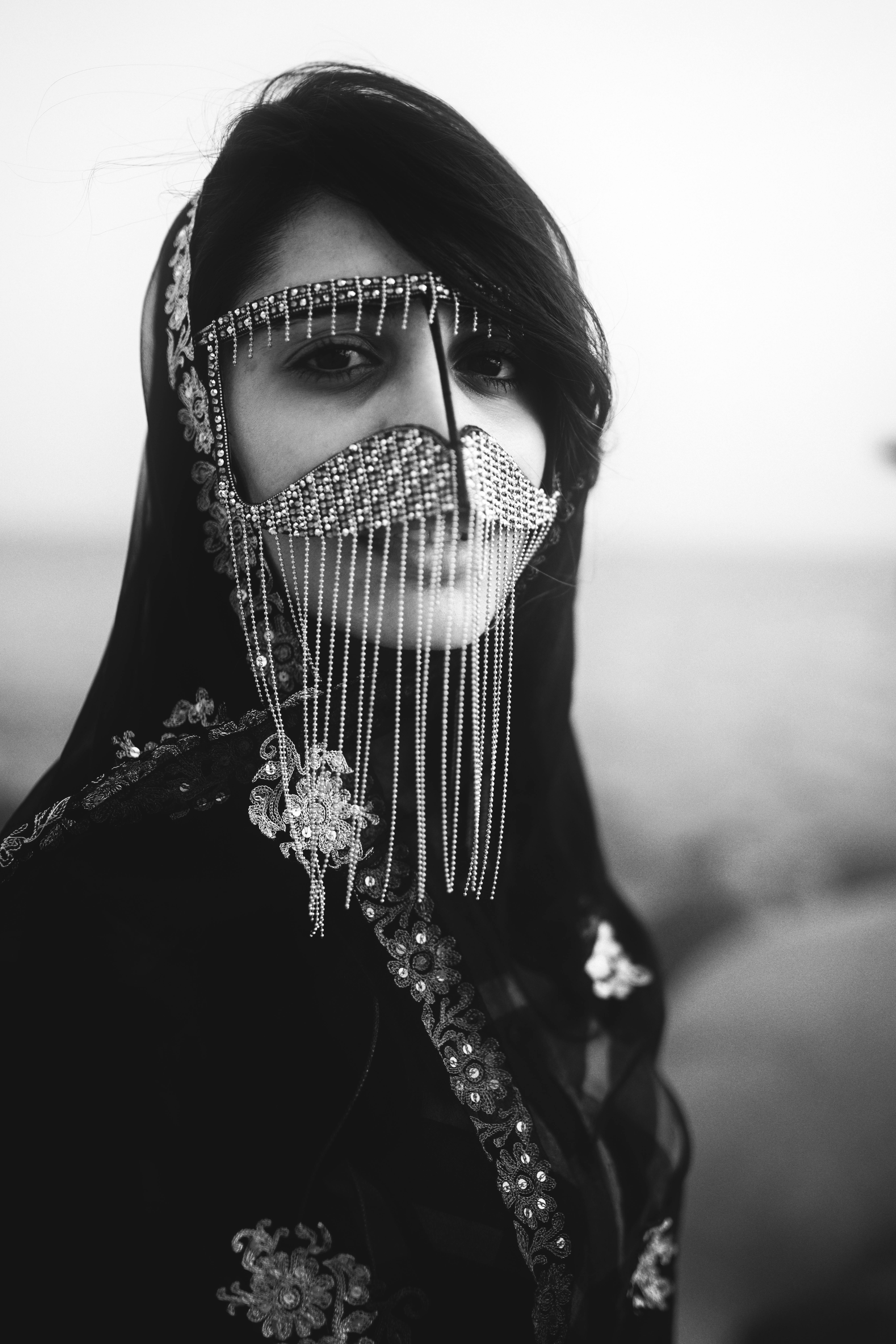 black and white portrait of woman in traditional persian clothing