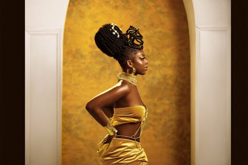 Side View of Sophisticated Woman in Golden Dress 