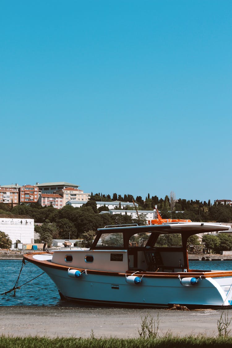 White And Blue Boat On Water