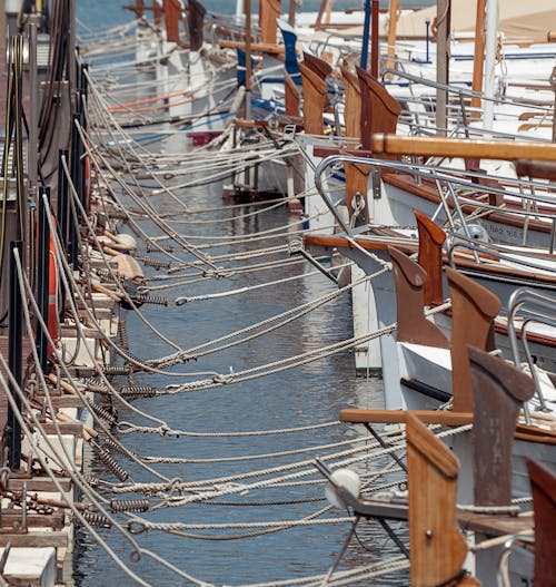 Close-up of Ropes Tying Boats to a Pier in a Port
