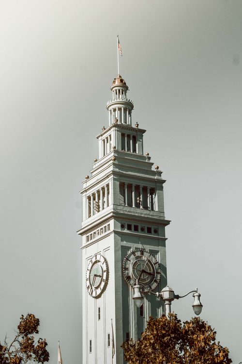 Free The historic Ferry Building clock tower in San Francisco under cloudy skies. Stock Photo
