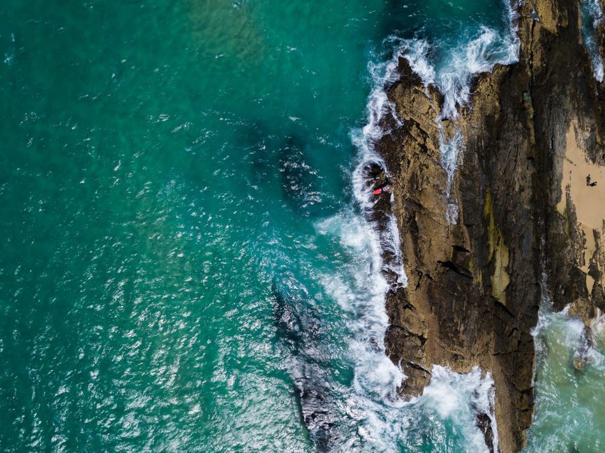 Nitmiluk Scenic Express Helicopter Tour Fly Over 3 Gorges - Spectacular aerial shot of the rugged coastline at Currumbin, Australia, with crashing waves and turquoise waters.
