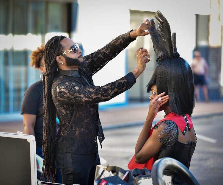 Man Raising Woman Hair