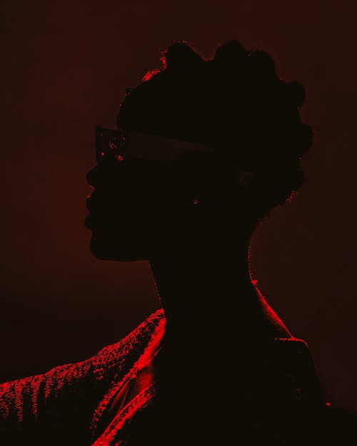 Side Profile of a Woman in Dark Red Light