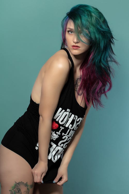 Free A Woman in Black Tank Top with Dyed Hair Stock Photo
