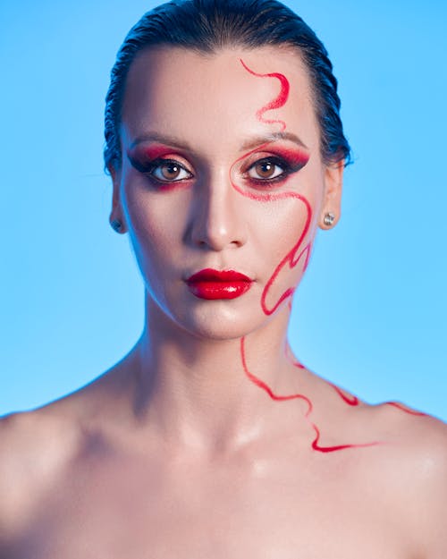 Portrait of a Woman with Red Artistic Makeup