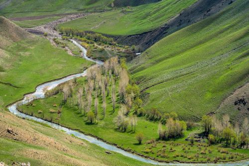 Free A stunning aerial view of a river valley with lush greenery in Edremit, Van. Stock Photo