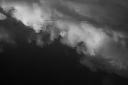 Reflection of Clouds in Puddle