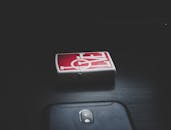 2017 Black Samsung Galaxy J7 Max Near Red and Grey Love Print Flip Lighter on Top of Black Surface