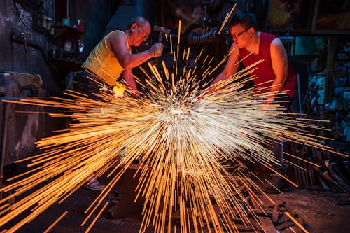 Sparks from the Grinder in a Workshop 