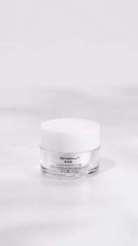 Close-up of a cosmetic cream jar on a white background. Perfect for skincare branding.