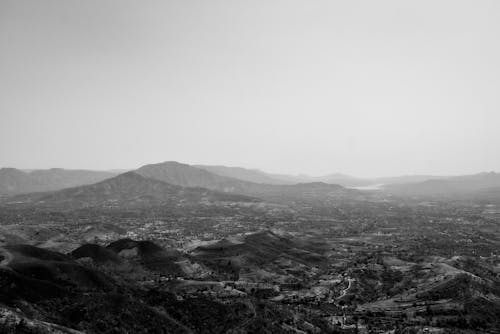 Grayscale Photo of Mountains