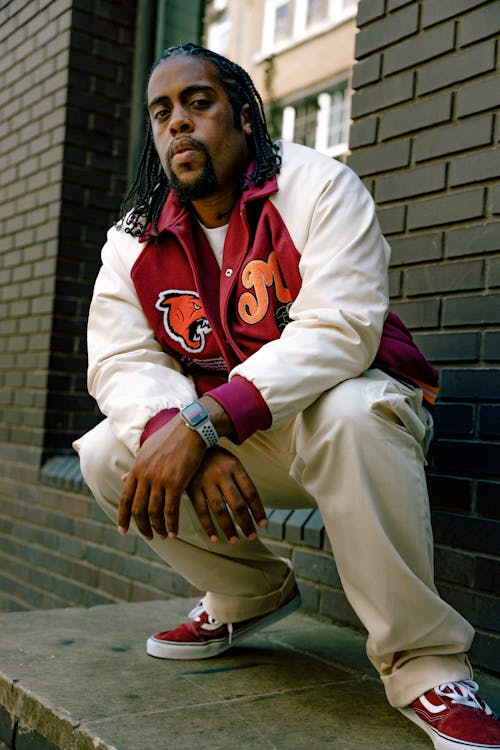 A Man with Braided Hairstyle While Posing 