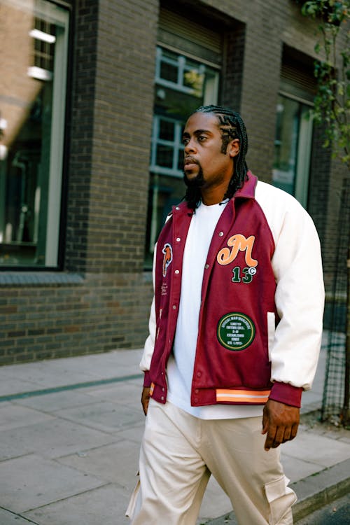 Portrait of a Man Walking in a Lettermans Jacket