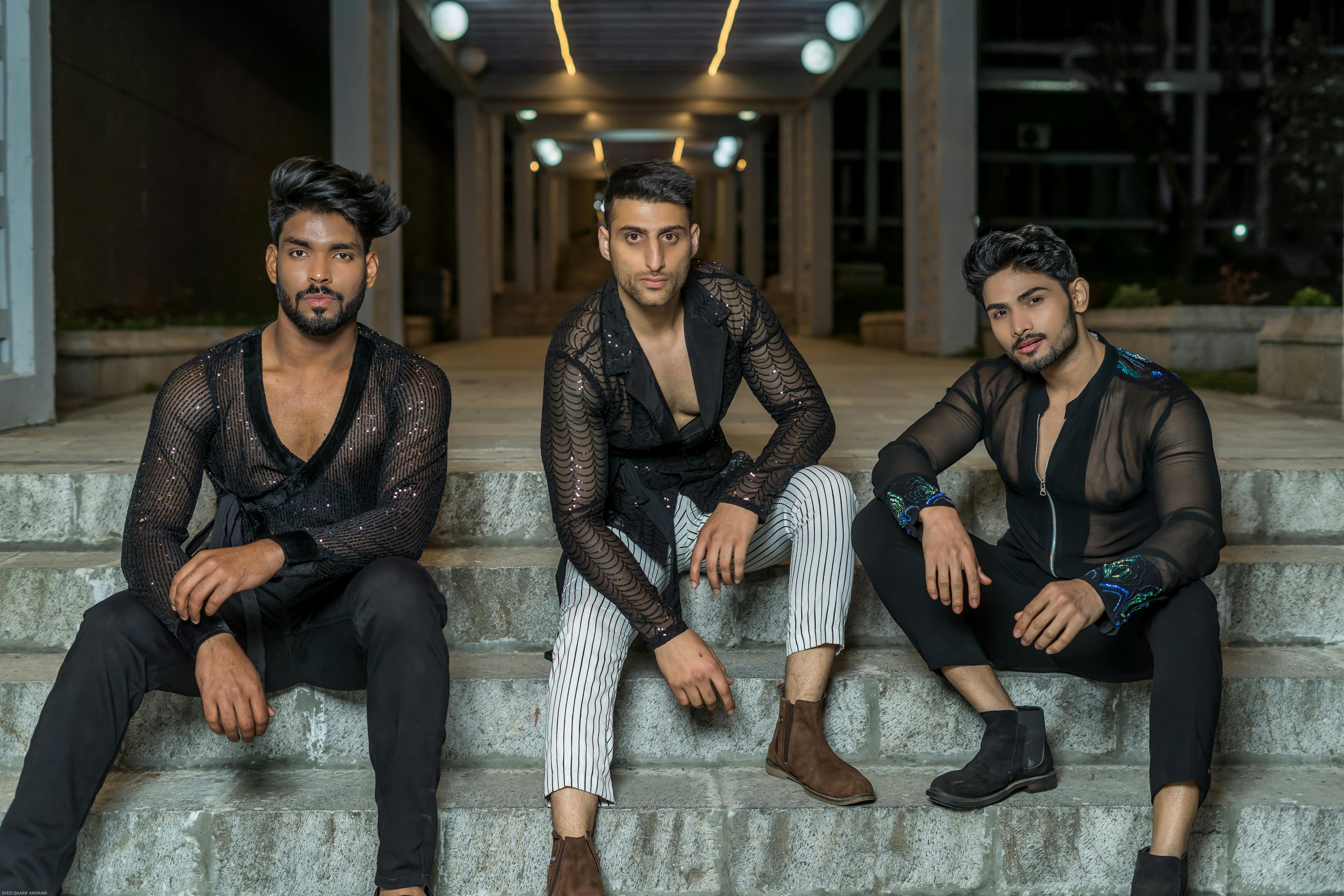 Men in Black See Through Long Sleeves Sitting on Concrete Stairs · Free