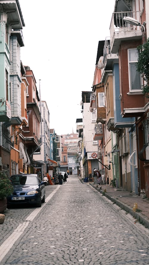 Narrow Street between Concrete Buildings