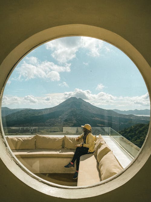 A Person Sitting on a Balcony 