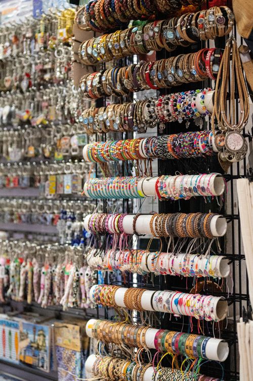 Free Vibrant assortment of bracelets and souvenirs hanging in a Lisbon shop. Stock Photo