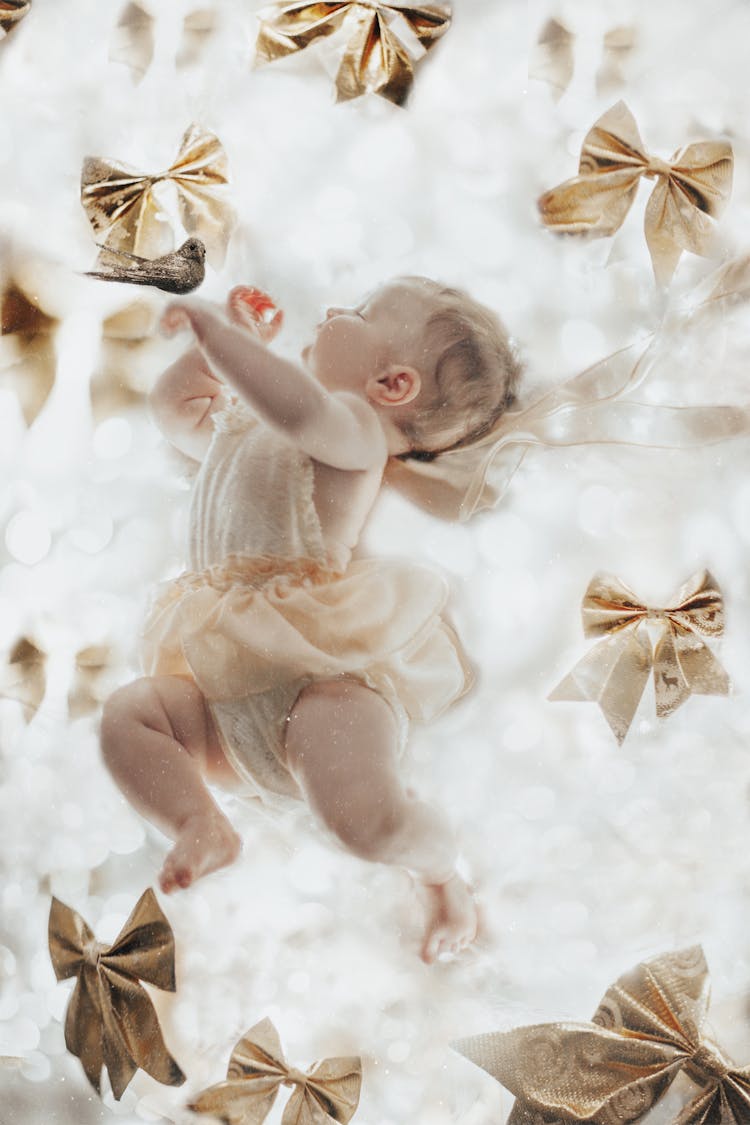 Baby In Dress And Ribbons