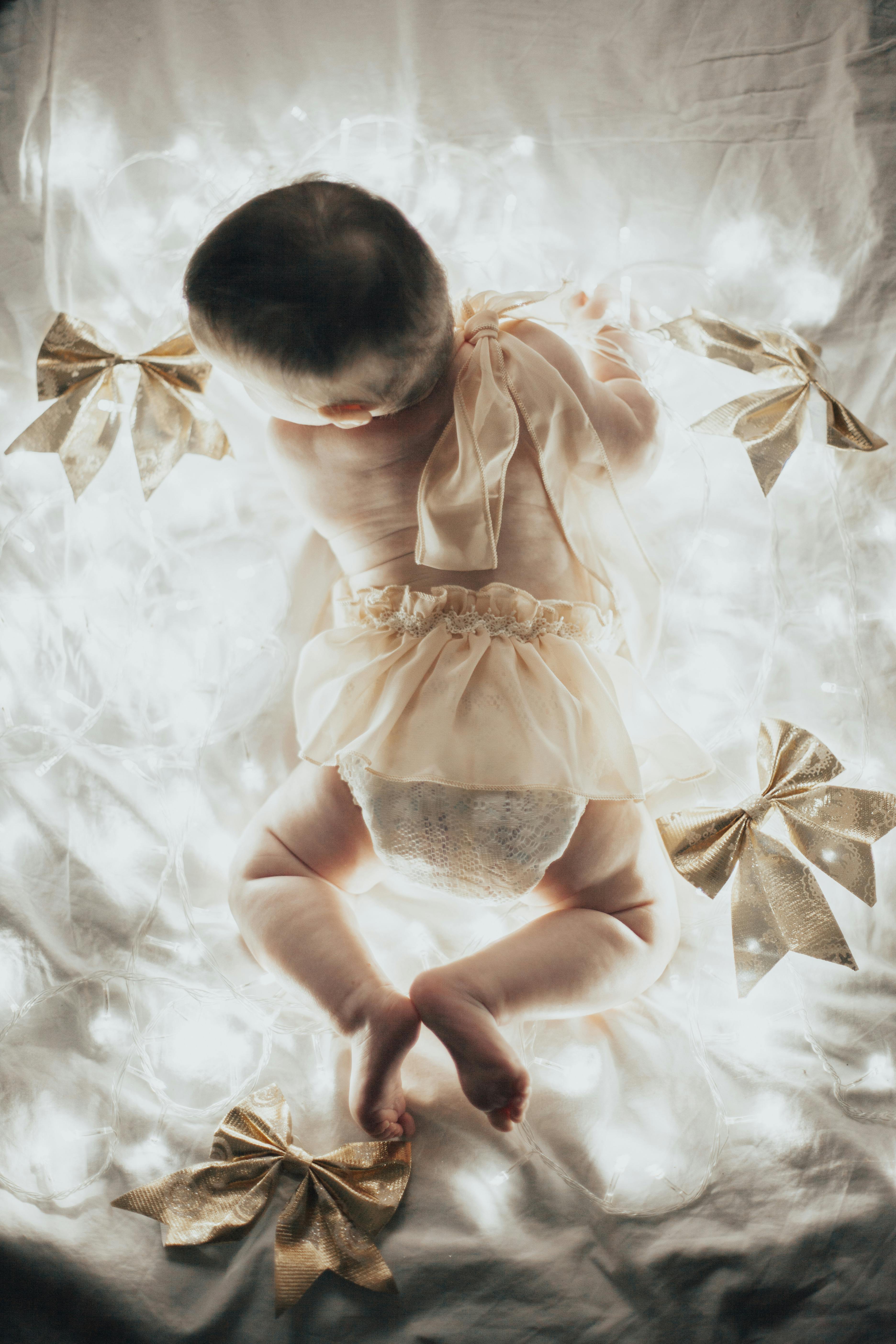 A Baby and Christmas Lights · Free Stock Photo