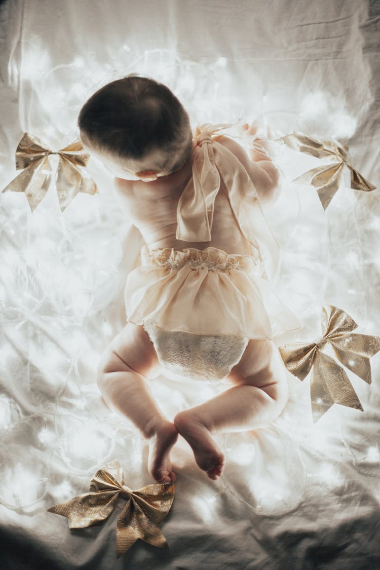 A Baby And Christmas Lights 