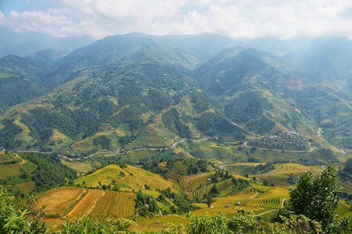 Green and Brown Mountains Under White Sky