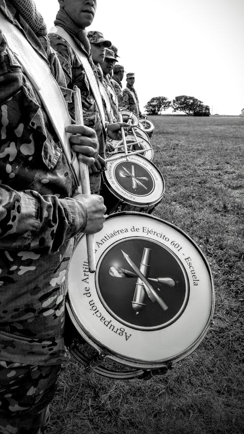 Grayscale Photo of Military Band in Camouflage Uniform