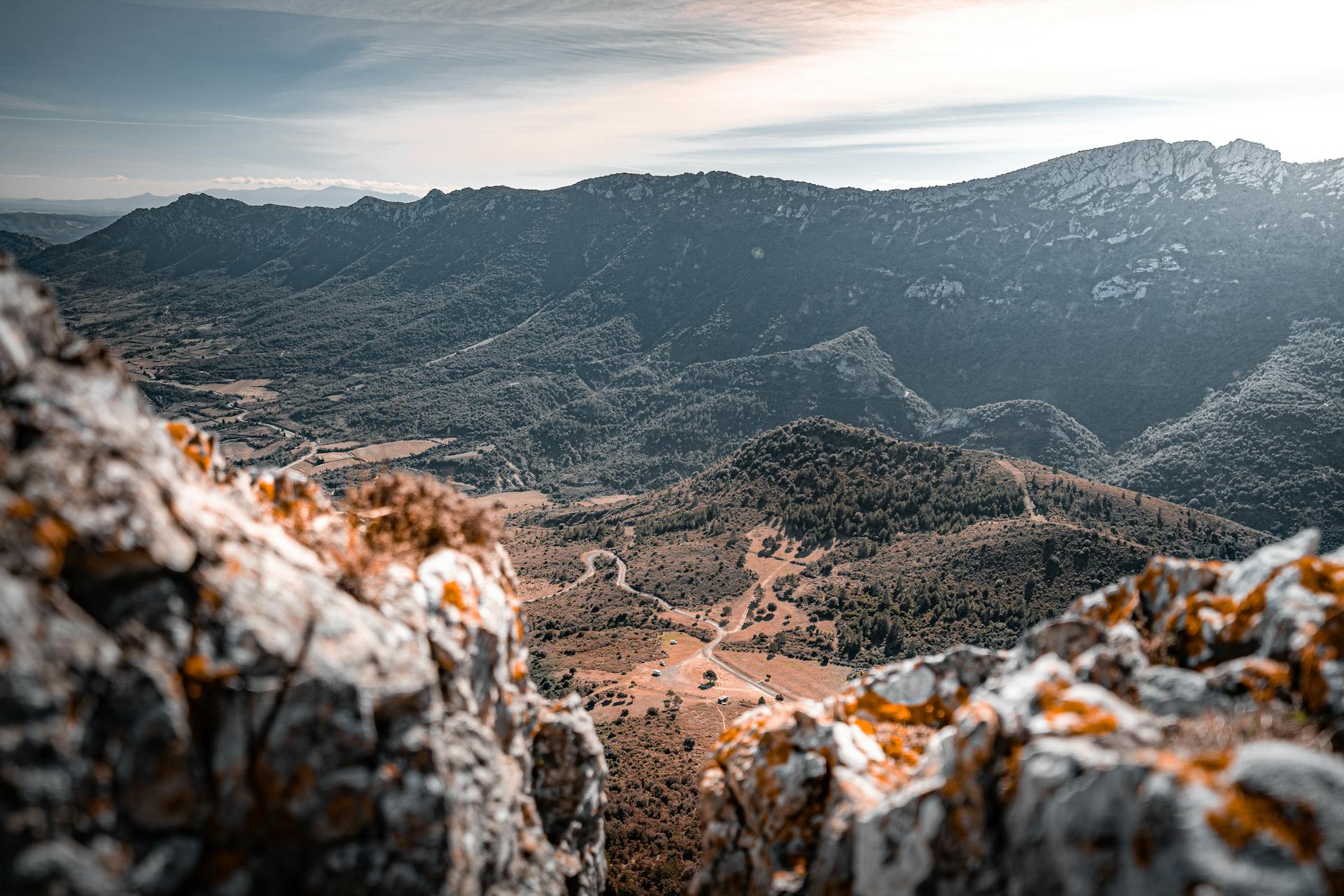 Breathtaking landscape of Audes mountains and winding roads in Auvergne-Rhône-Alpes, France.