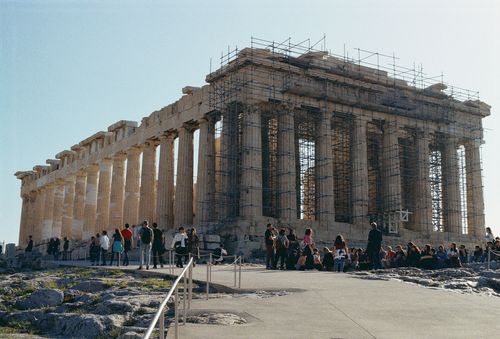 Free The Parthenon in Athens, Greece with scaffolding and tourists in the foreground. Stock Photo