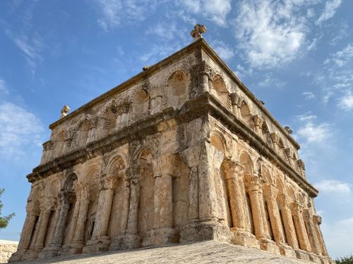 Free Low angle view of the ancient Roman church facade in Mardin, Türkiye against a blue sky. Stock Photo