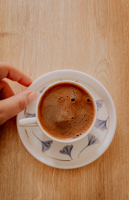 Free Cup of Coffee on Wooden Surface Stock Photo