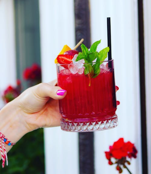 Red Cocktail with Fruit Slice on Top