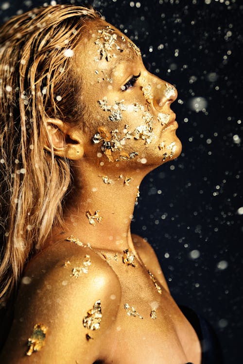 Topless Woman With Water Droplets on Her Face