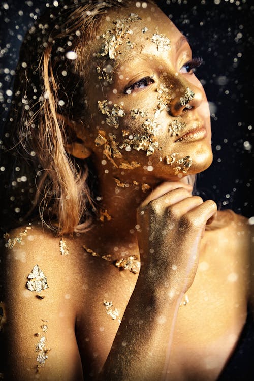 Topless Woman With Water Droplets on Her Face