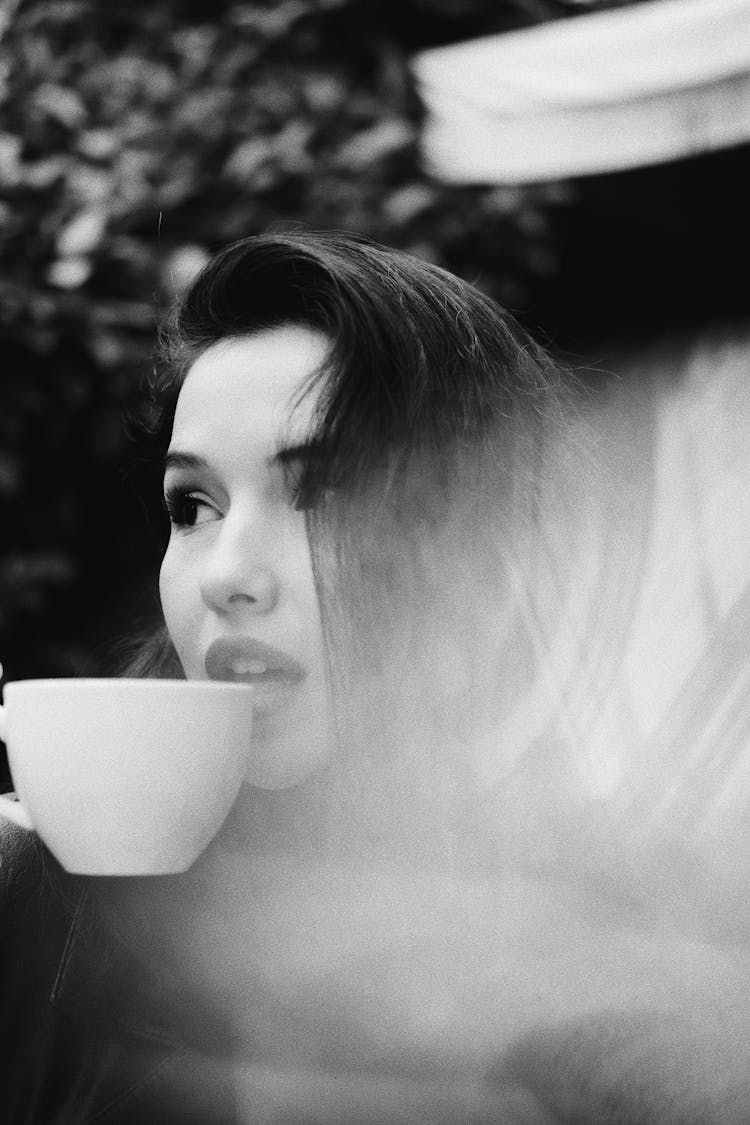 Woman Drinking From White Ceramic Mug