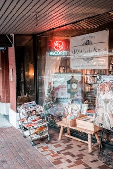 A cozy record shop adorned with vintage decor and festive holiday displays in a bustling city area.