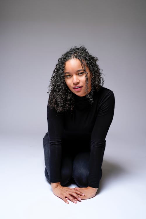 Woman Dressed in Black against a White Background 