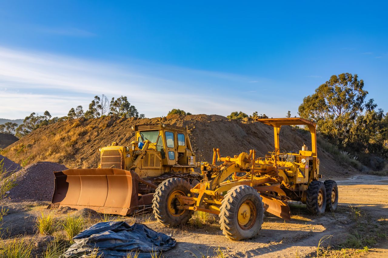Bulldozer and grader levelling a construction site in Melbourne's western suburbs