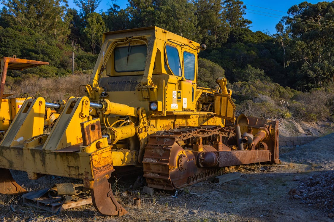 Yellow Heavy Equipment on Dirt Ground