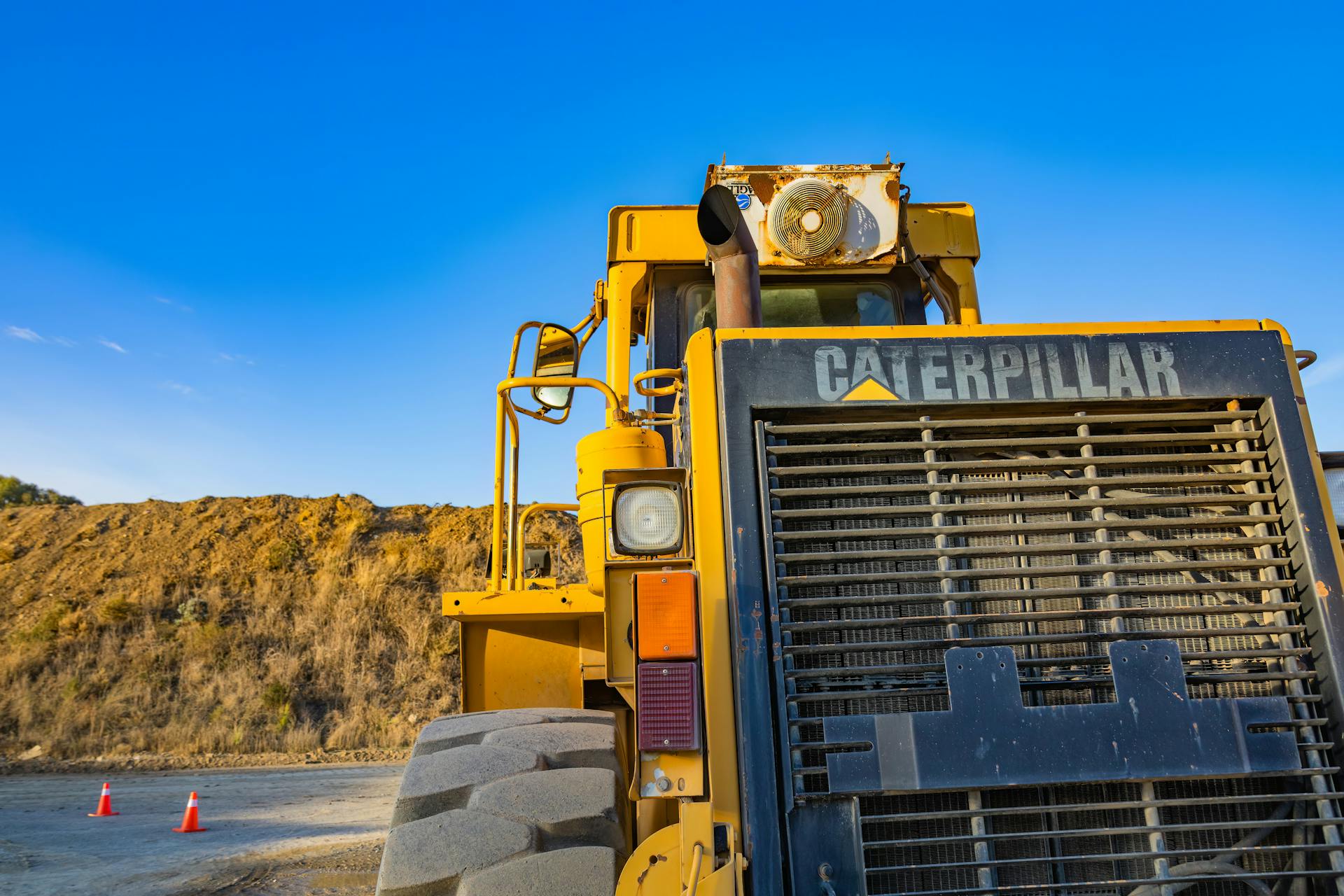 Yellow and Black Heavy Equipment on Brown Field
