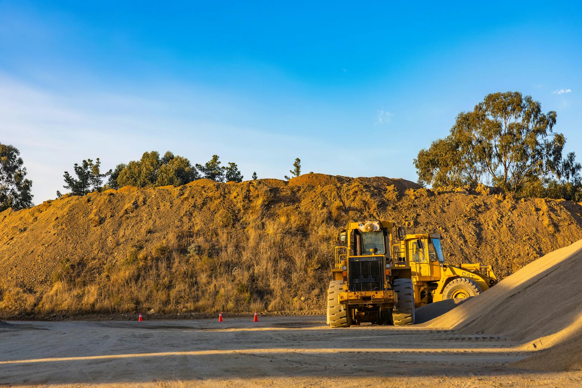 Yellow and Black Heavy Equipment on Road