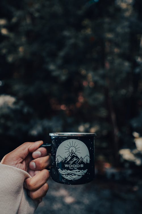 A Person Holding a Mug