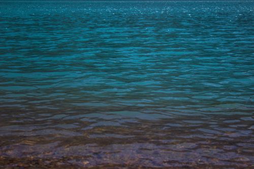 Free Calm blue ocean surface with gentle ripples under daylight, perfect for serene backgrounds. Stock Photo