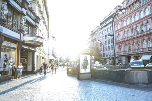 People Walking on Street Surrounded by Buildings