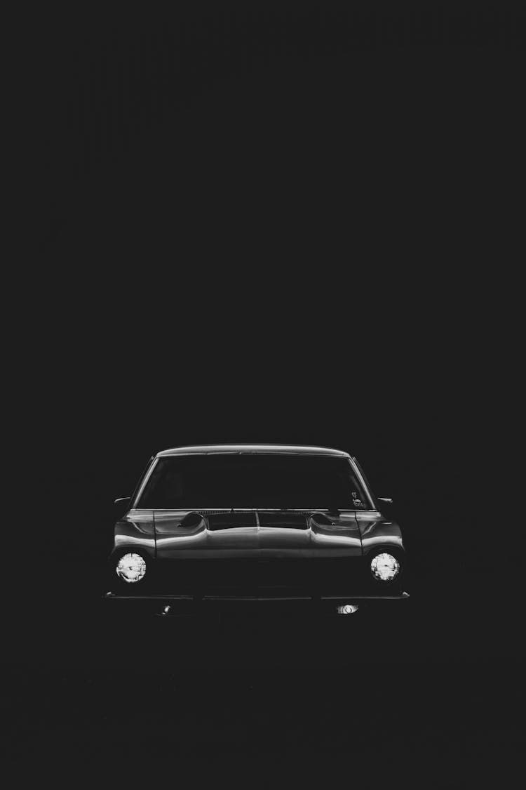 A Black Classic Car On Dark Background