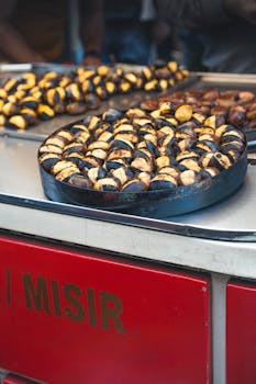 A street vendor's tray of roasted chestnuts in Istanbul, Turkey.