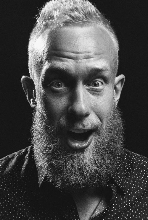 Free Striking monochrome portrait capturing the expression of a bearded man with unique facial features. Stock Photo