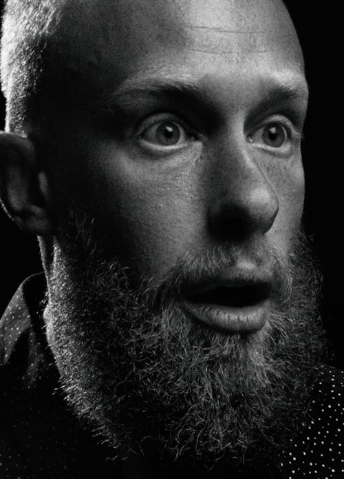 Grayscale Photo of a Surprised Man 